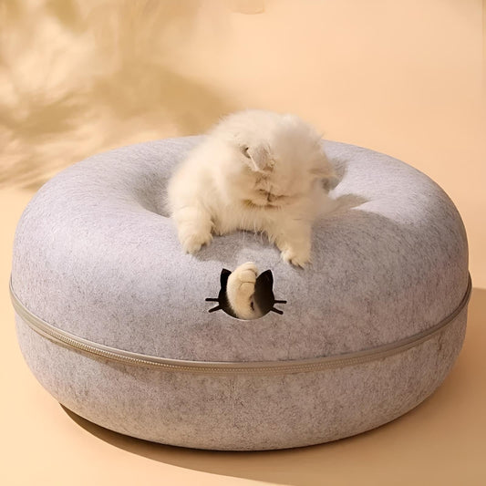 kitten resting inside a soft, felt tunnel bed with open ends